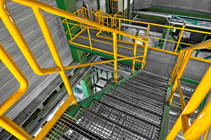 yellow steel railing on staircase
